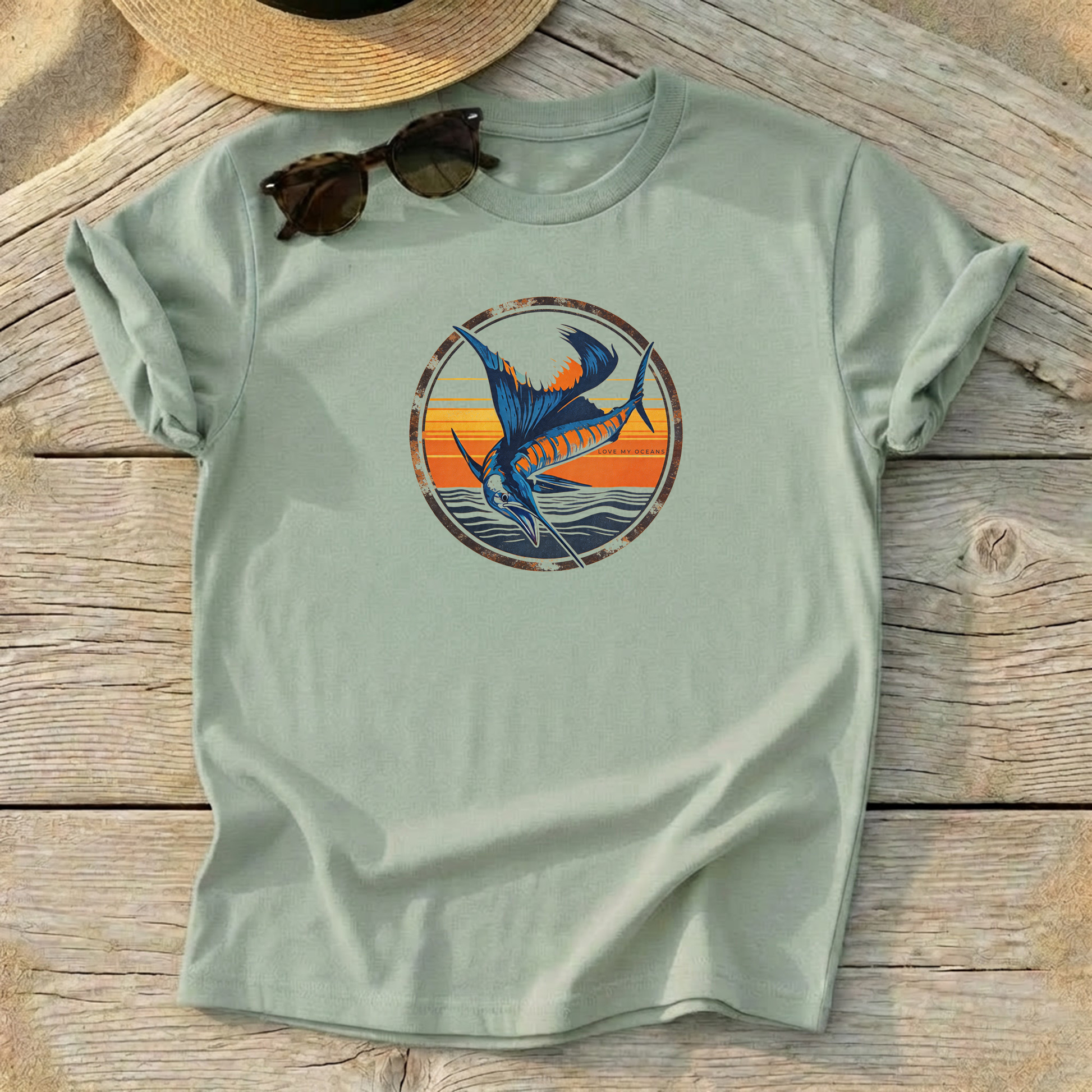 Sailfish Sunset Badge Tee — offshore sailfish fishing shirt, coastal apparel, Love My Oceans